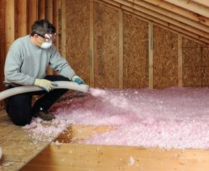 Filling an attic with blown-in insulation 